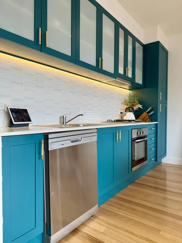 Renovated kitchen with teal cabinetry, Pascoe Vale