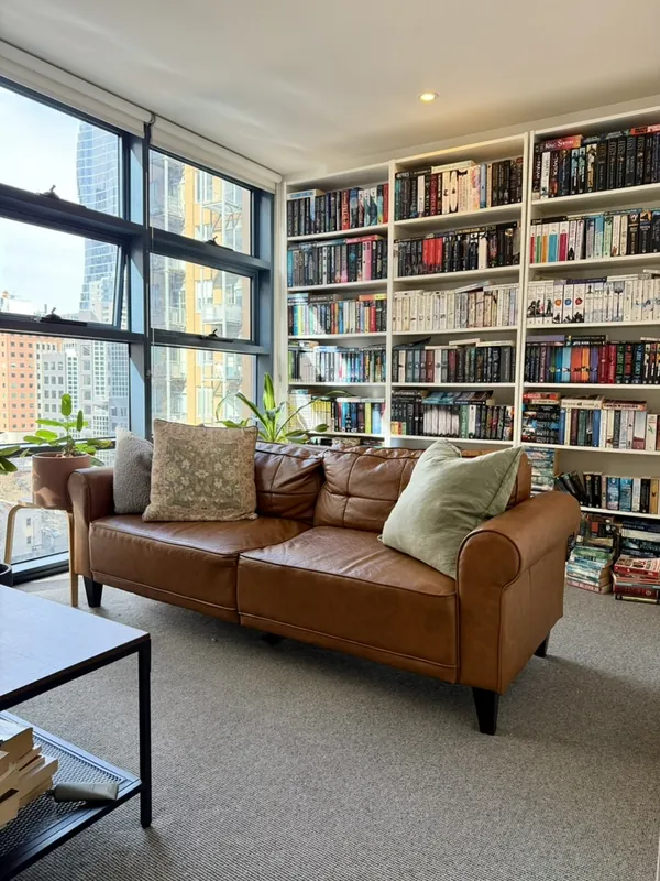 Living room with built-in bookshelves, Melbourne CBD apartment