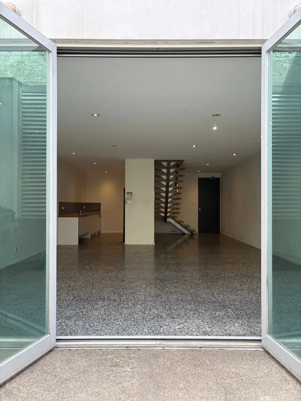Open-plan ground floor with courtyard doors, Richmond townhouse