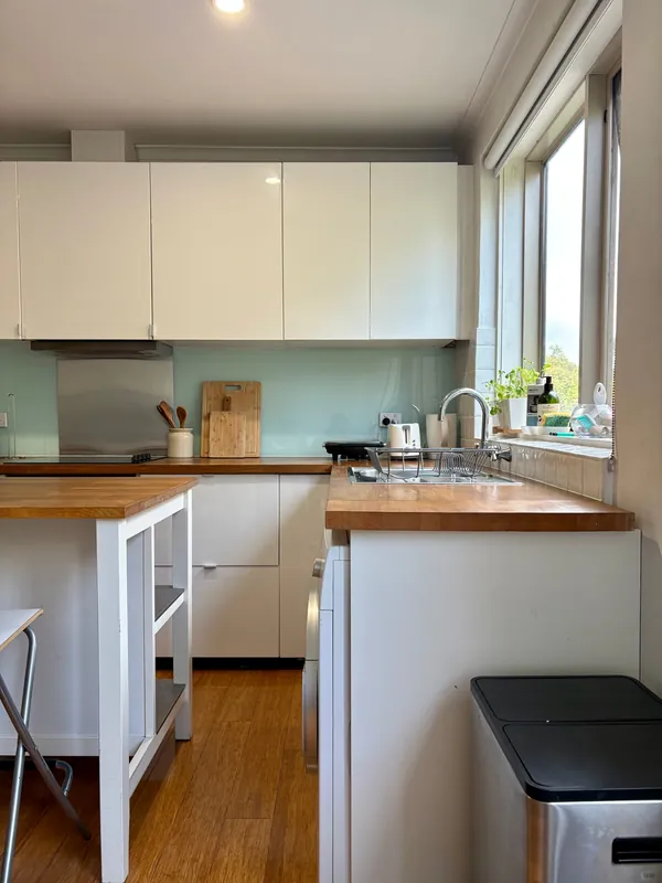 Kitchen with timber benchtops, South Yarra apartment