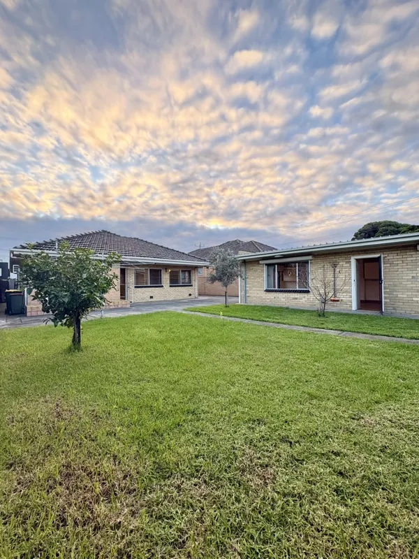 Brick home with front lawn, Altona North